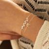 imageTurandoss Gold Initial Bracelet for Women  14K Gold Plated Charm M Initial Layered Bracelets for Women Trendy Dainty Personalized Gold CZ Leaf Charm Bracelets for Women Gifts
